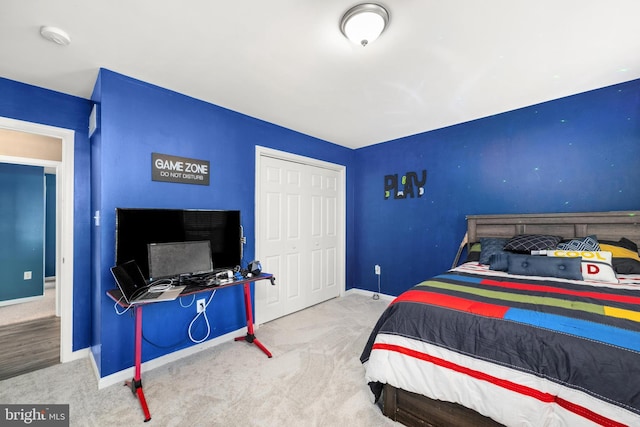 carpeted bedroom featuring a closet