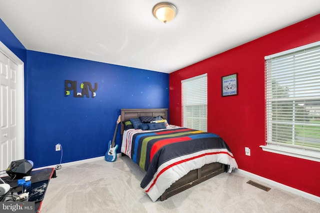 bedroom featuring a closet and carpet floors