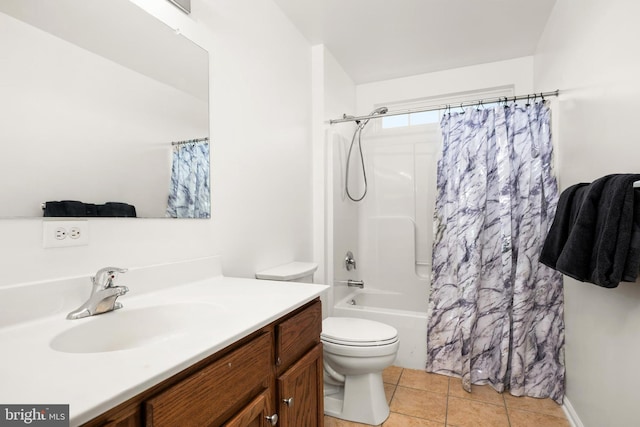 full bathroom featuring shower / bath combo with shower curtain, toilet, tile patterned flooring, and vanity