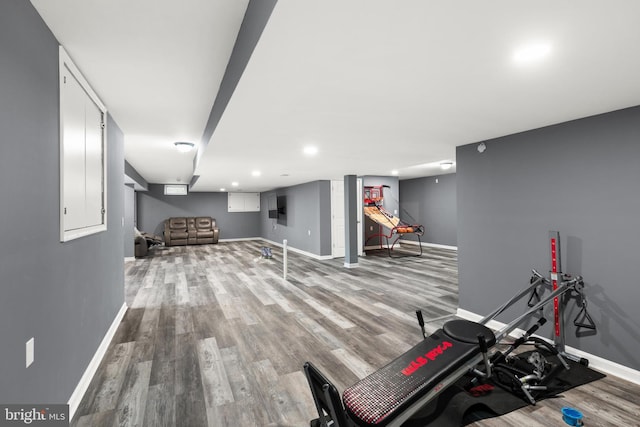 exercise room with hardwood / wood-style flooring