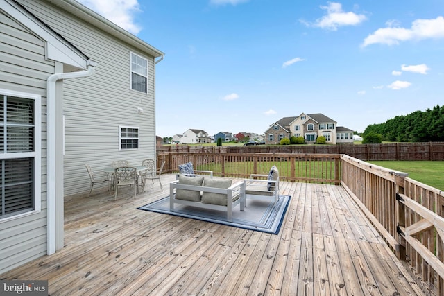 wooden deck featuring an outdoor living space