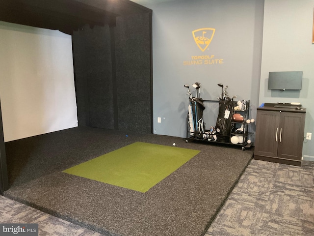 recreation room with carpet and golf simulator