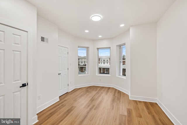 unfurnished room featuring light hardwood / wood-style flooring