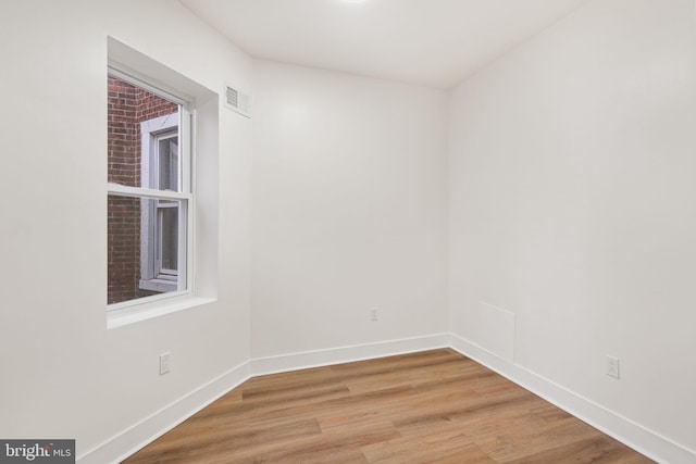 spare room featuring hardwood / wood-style floors