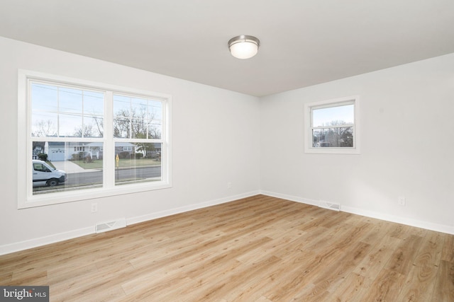 unfurnished room featuring light hardwood / wood-style flooring