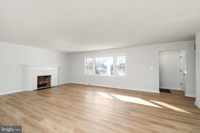 unfurnished living room featuring light hardwood / wood-style flooring