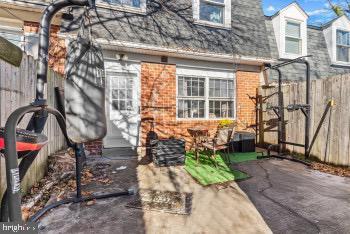 rear view of property with a patio area