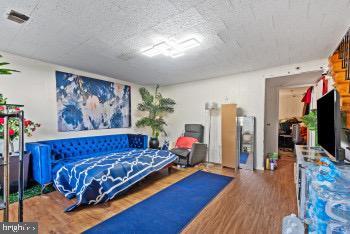 bedroom featuring hardwood / wood-style flooring