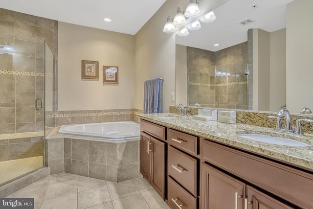 bathroom with tile patterned flooring, vanity, and independent shower and bath