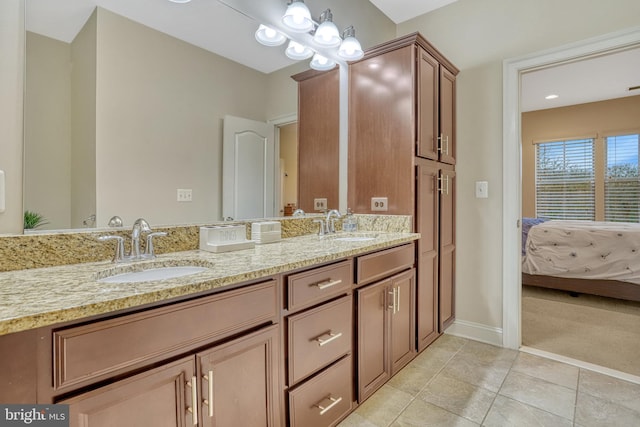 bathroom featuring tile patterned flooring and vanity