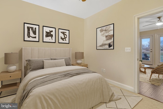 bedroom featuring light carpet and ceiling fan