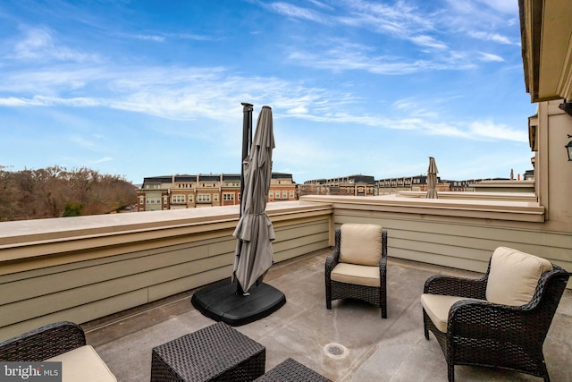 view of patio with a balcony