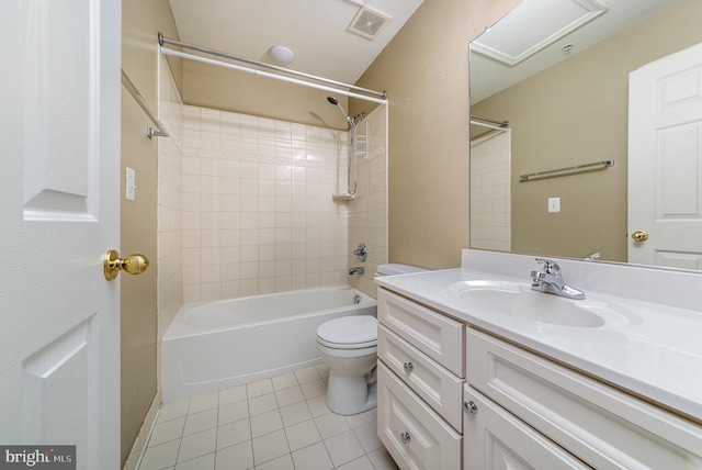 full bathroom with tile patterned flooring, vanity, toilet, and tiled shower / bath combo