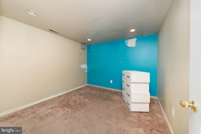 unfurnished room with light colored carpet