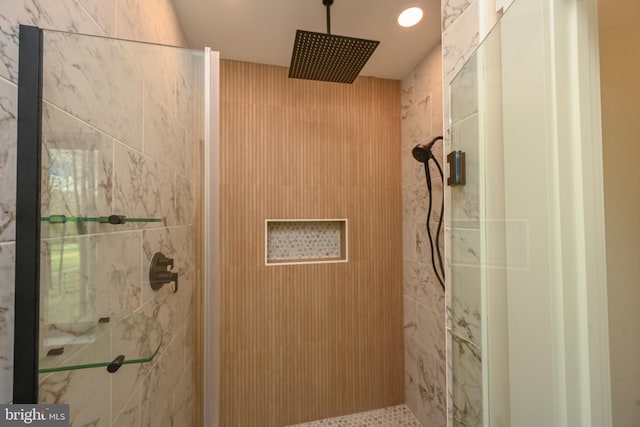 bathroom with a tile shower