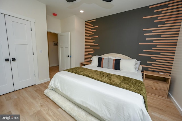 bedroom with light wood-type flooring, baseboards, recessed lighting, and a ceiling fan