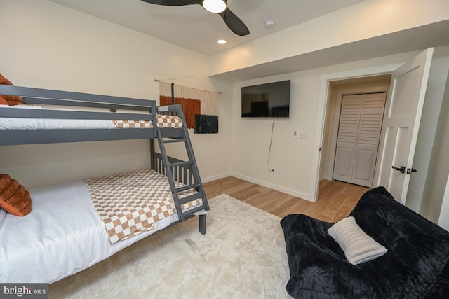 bedroom featuring wood finished floors, baseboards, a ceiling fan, and recessed lighting