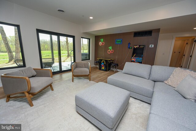 living room featuring light wood-style flooring and recessed lighting