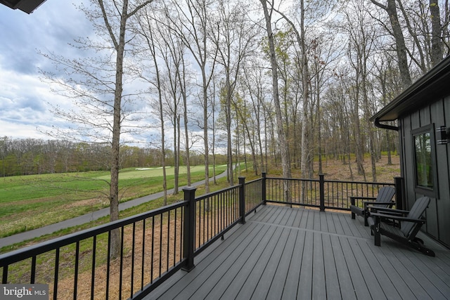 wooden terrace with a yard