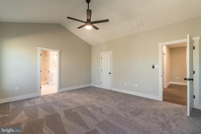 unfurnished bedroom with carpet floors, vaulted ceiling, and ceiling fan