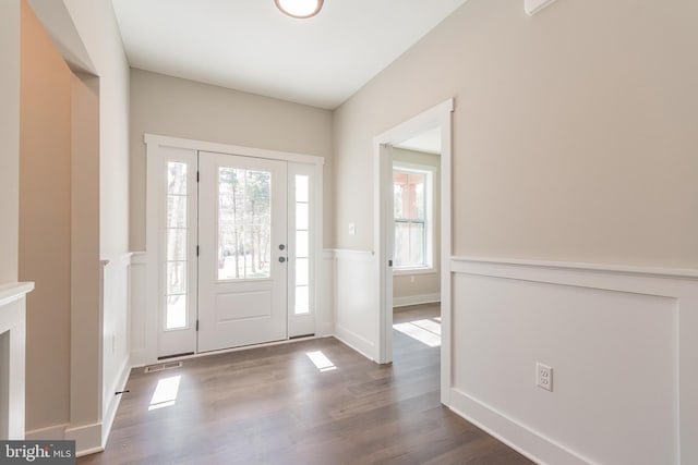 entryway featuring dark hardwood / wood-style flooring and a healthy amount of sunlight