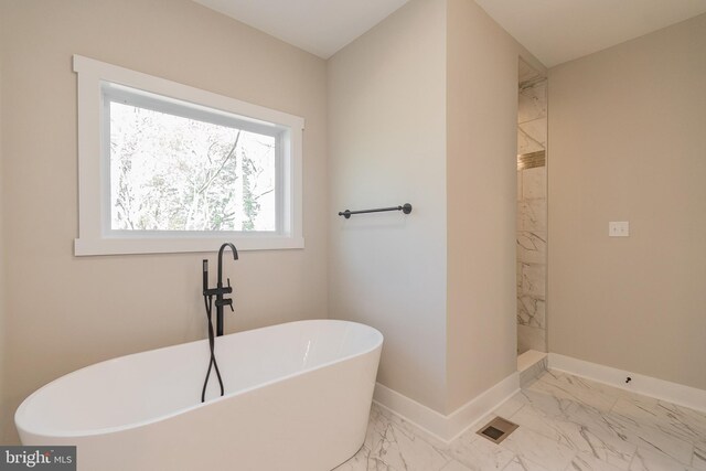 bathroom featuring separate shower and tub