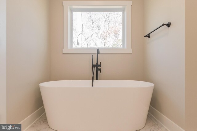 bathroom featuring a tub to relax in