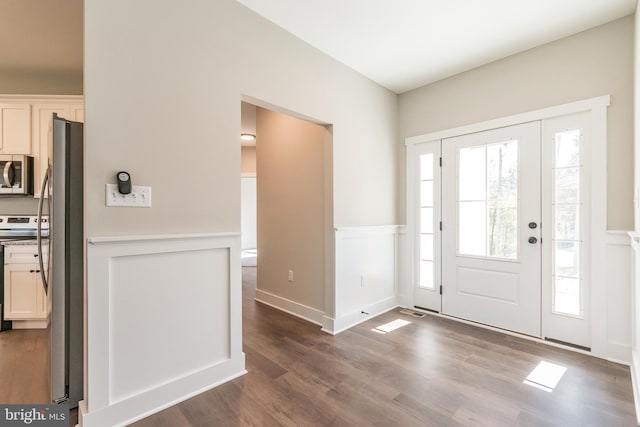 entrance foyer featuring dark hardwood / wood-style floors