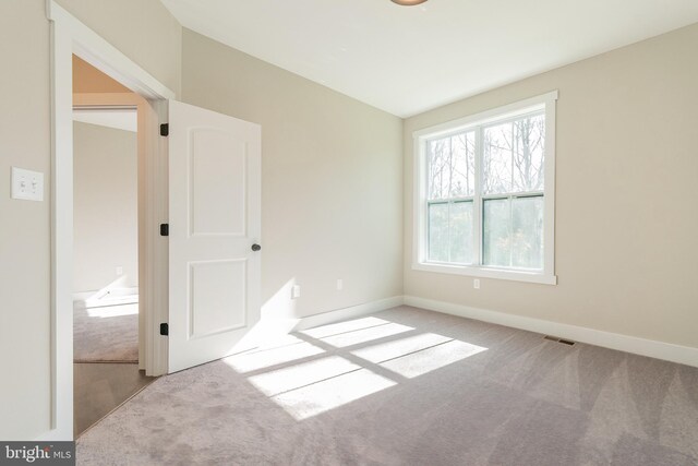 view of carpeted spare room