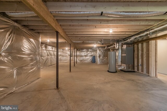 basement featuring heating unit and gas water heater