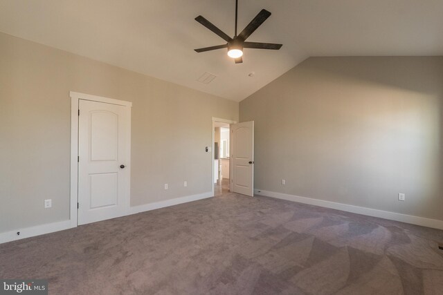 unfurnished bedroom with carpet flooring, ceiling fan, and lofted ceiling