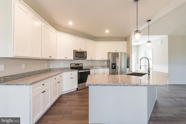 kitchen with white cabinetry, sink, and stainless steel appliances