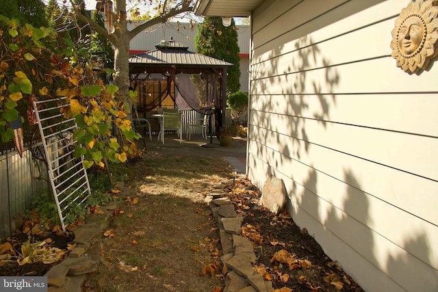 view of property exterior featuring a gazebo