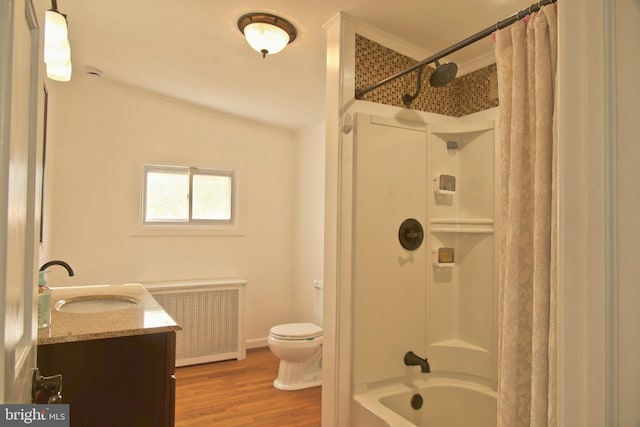 full bathroom with radiator, ornamental molding, vanity, shower / tub combo with curtain, and hardwood / wood-style flooring