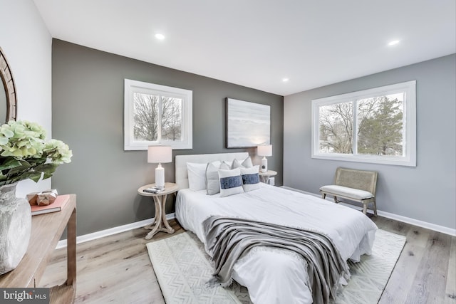 bedroom with light hardwood / wood-style flooring