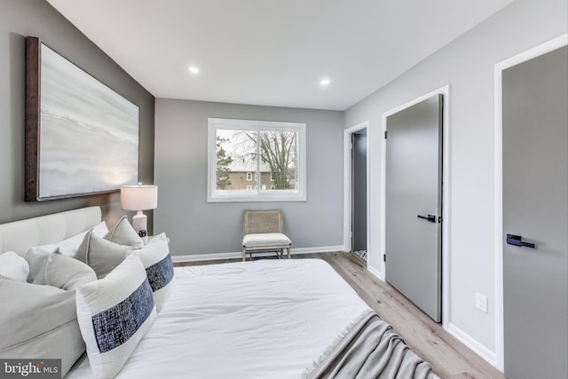 bedroom with light wood-type flooring