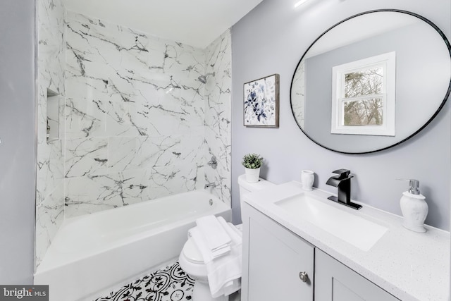 bathroom featuring vanity and tiled shower / bath combo