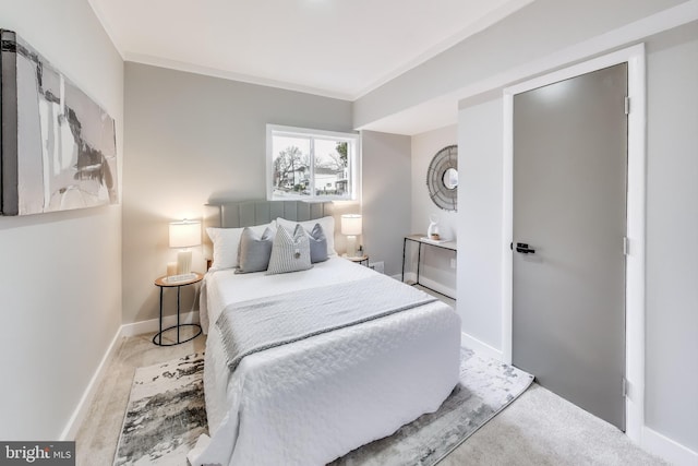 bedroom featuring light hardwood / wood-style flooring and ornamental molding