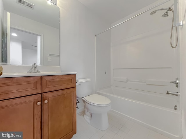 full bathroom featuring tile patterned floors, vanity, toilet, and tub / shower combination