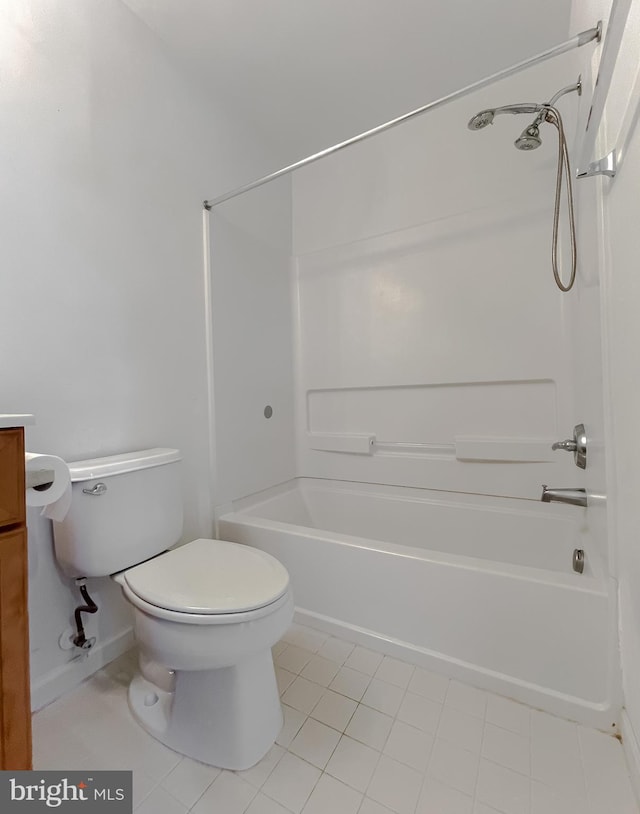 bathroom with tile patterned flooring, toilet, and shower / tub combination