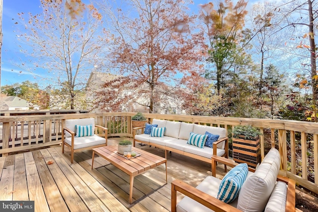 wooden deck featuring outdoor lounge area