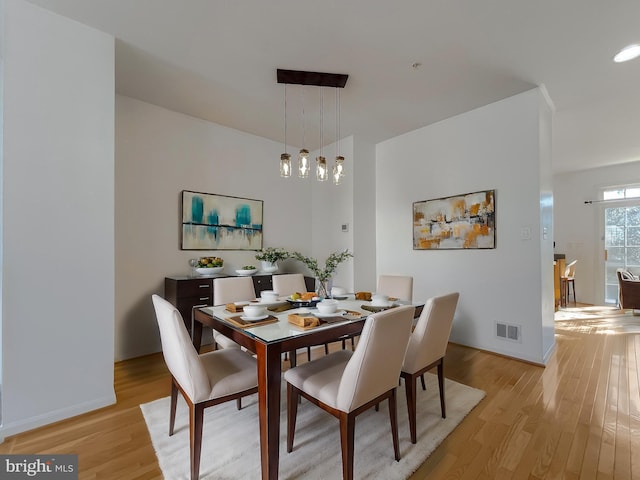 dining space featuring light hardwood / wood-style flooring