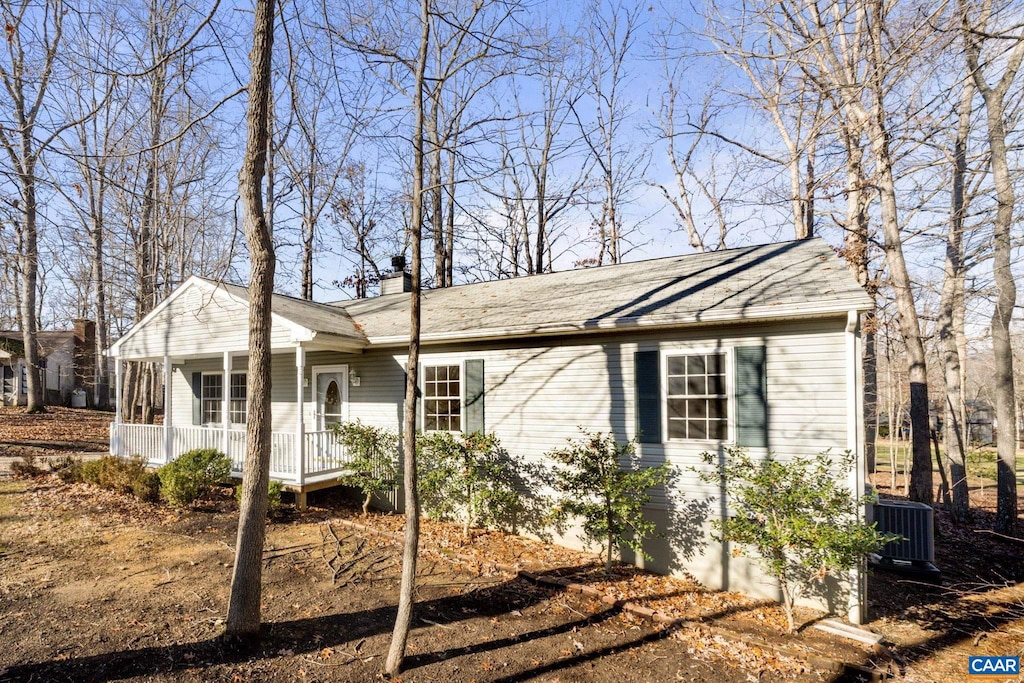 view of front facade with covered porch and central AC unit