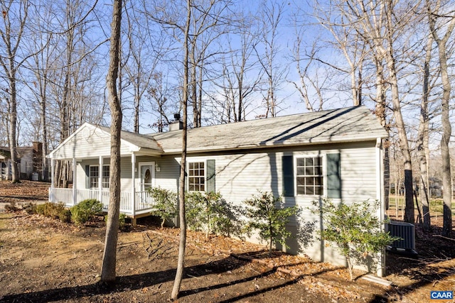 view of front facade with covered porch and central AC unit