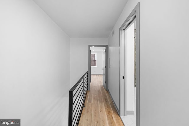 hallway with light wood-type flooring