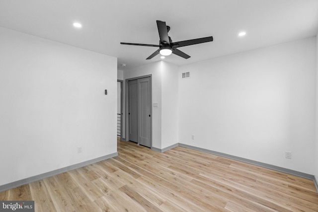 unfurnished room featuring light hardwood / wood-style floors and ceiling fan