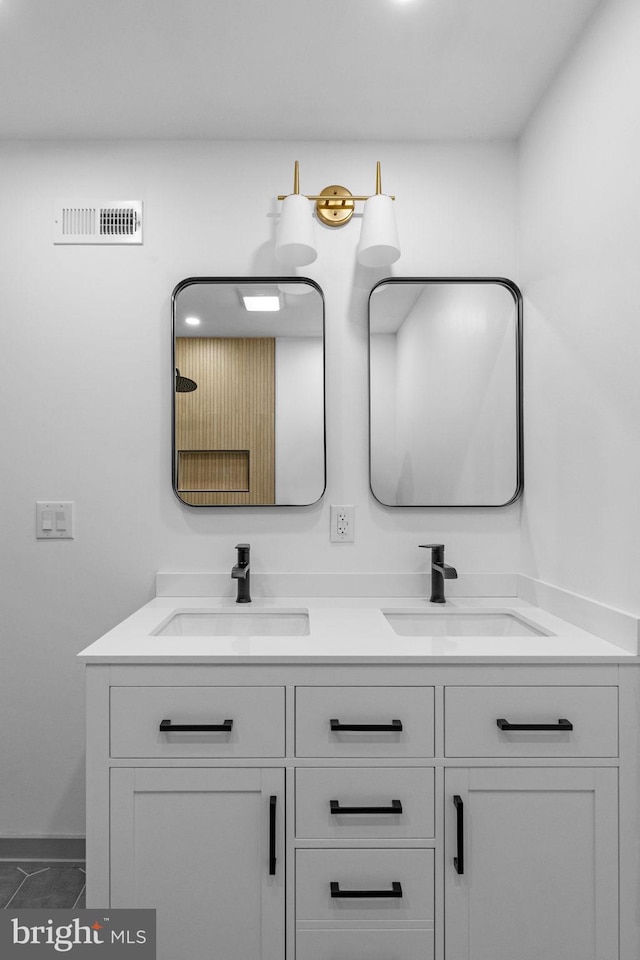 bathroom featuring tile patterned flooring and vanity