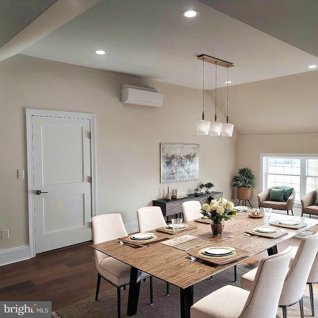 dining area featuring dark hardwood / wood-style flooring and a wall mounted AC