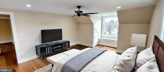 bedroom featuring ceiling fan, wood-type flooring, and lofted ceiling