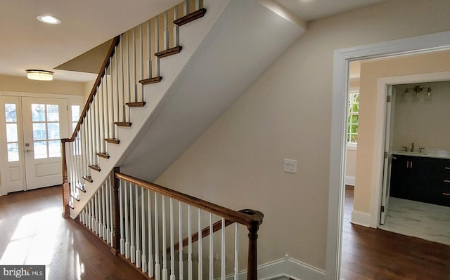 stairs with hardwood / wood-style flooring